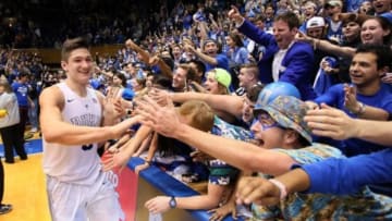 Feb 13, 2016; Durham, NC, USA; Duke Blue Devils guard Grayson Allen (3) celebrates with the Cameron Crazies after making the game winning basket in the second half of their game against the Virginia Cavaliers to win 63-62 at Cameron Indoor Stadium. Mandatory Credit: Mark Dolejs-USA TODAY Sports
