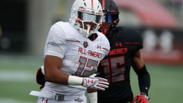 Jan 2, 2016; Orlando, FL, USA; Team Highlight player Keandre Jones (16) chases Team Highlight player Devwah Waley (12) in the Under Armour All American Football Game at the Orlando Citrus Bowl. Team Highlight beat Team Armour 27-0. Mandatory Credit: Reinhold Matay-USA TODAY Sports