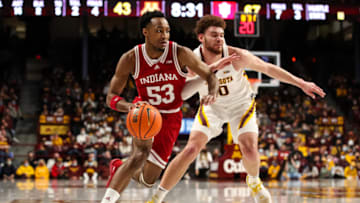 MINNEAPOLIS, MN - FEBRUARY 27: Tamar Bates #53 of the Indiana Hoosiers drives to the basket while Jamison Battle #10 of the Minnesota Golden Gophers defends in the second half of the game at Williams Arena on February 27, 2022 in Minneapolis, Minnesota. The Hoosiers defeated the Golden Gophers 84-79. (Photo by David Berding/Getty Images)