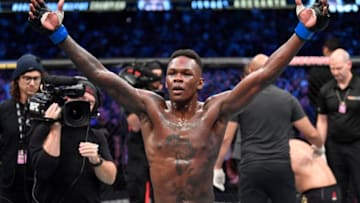 MELBOURNE, AUSTRALIA - OCTOBER 06: Israel Adesanya of Nigeria celebrates after his knockout victory over Robert Whittaker of New Zealand in their UFC middleweight championship fight during the UFC 243 event at Marvel Stadium on October 06, 2019 in Melbourne, Australia. (Photo by Jeff Bottari/Zuffa LLC/Zuffa LLC via Getty Images)