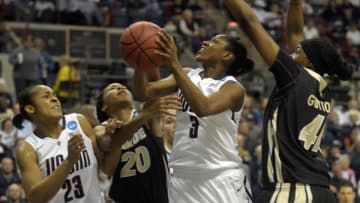 Connecticut Huskies forward Maya Moore (23), Purdue Boilermakers guard/forward Dee Dee Williams (20), Connecticut Huskies guard Tiffany Hayes (3), and Purdue Boilermakers forward Alex Guyton (41) battle during first-half action in the second round of the women's NCAA basketball tournament at Gampel Pavilion in Storrs, Connecticut, Tuesday, March 22, 2011. The Huskies won, 64-40. (Richard Messina/Hartford Courant/Tribune News Service via Getty Images)