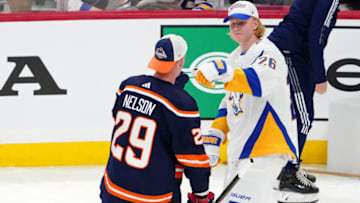 Feb 3, 2023; Sunrise, Florida, USA; Edmonton Oilers center Leon Draisaitl (29) fist bumps Buffalo Sabres defensemen Rasmus Dahlin (26) during the 2023 NHL All-Star Skills Competition at FLA Live Arena. Mandatory Credit: Jasen Vinlove-USA TODAY Sports