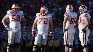 PASADENA, CA - JANUARY 02: (L-R) Offensive linemen Ricky Wagner #58, Travis Frederick #72, Peter Konz #66 and Kevin Zeitler #70 of the Wisconsin Badgers stand on the field while taking on the Oregon Ducks at the 98th Rose Bowl Game on January 2, 2012 in Pasadena, California. (Photo by Harry How/Getty Images)