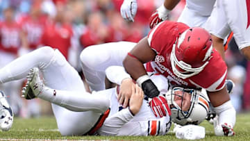 Oct 24, 2015; Fayetteville, AR, USA; Arkansas Razorbacks defensive lineman Jeremiah Ledbetter (55) sacks Auburn Tigers quarterback Sean White (13) during the second half at Donald W. Reynolds Razorback Stadium. Mandatory Credit: Jasen Vinlove-USA TODAY Sports