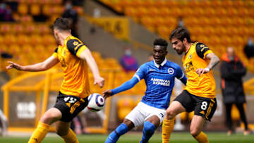 WOLVERHAMPTON, ENGLAND - MAY 09: Yves Bissouma of Brighton and Hove Albion battles for possession with Ruben Neves of Wolverhampton Wanderers during the Premier League match between Wolverhampton Wanderers and Brighton & Hove Albion at Molineux on May 09, 2021 in Wolverhampton, England. Sporting stadiums around the UK remain under strict restrictions due to the Coronavirus Pandemic as Government social distancing laws prohibit fans inside venues resulting in games being played behind closed doors. (Photo by Tim Keeton - Pool/Getty Images)