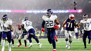 FOXBOROUGH, MASSACHUSETTS - JANUARY 04: Derrick Henry #22 of the Tennessee Titans carries the ball in the AFC Wild Card Playoff game against the New England Patriots at Gillette Stadium on January 04, 2020 in Foxborough, Massachusetts. (Photo by Adam Glanzman/Getty Images)