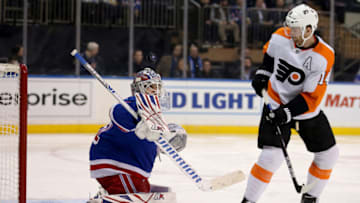 Dec 1, 2021; New York, New York, USA; New York Rangers goaltender Igor Shesterkin (31) makes a save against Philadelphia Flyers center Sean Couturier (14) during the third period at Madison Square Garden. Mandatory Credit: Brad Penner-USA TODAY Sports
