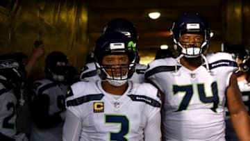 CHICAGO, IL - SEPTEMBER 17: Russell Wilson #3 and George Fant #74 of the Seattle Seahawks walk out to the field prior to the start of the game against the Chicago Bears at Soldier Field on September 17, 2018 in Chicago, Illinois. (Photo by Quinn Harris/Getty Images)