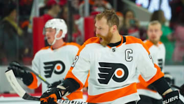 Mar 12, 2022; Raleigh, North Carolina, USA; Philadelphia Flyers center Claude Giroux (28) reacts against the Carolina Hurricanes before the game at PNC Arena. Mandatory Credit: James Guillory-USA TODAY Sports