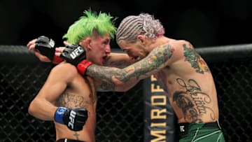 LAS VEGAS, NEVADA - JULY 10: Kris Moutinho (L) and Sean O'Malley exchange punches in the first round in their bantamweight bout during UFC 264: Poirier v McGregor 3 at T-Mobile Arena on July 10, 2021 in Las Vegas, Nevada. (Photo by Stacy Revere/Getty Images)