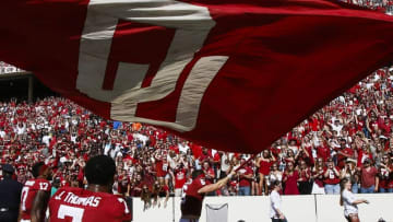 Oct 8, 2016; Dallas, TX, USA; Oklahoma Sooners quarterback Baker Mayfield (6) waves a flag after the game against the Texas Longhorns at Cotton Bowl. Oklahoma won 45-40. Mandatory Credit: Tim Heitman-USA TODAY Sports