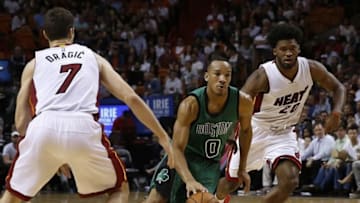 Nov 30, 2015; Miami, FL, USA; Boston Celtics guard Avery Bradley (0) dribbles the ball as Miami Heat guard Goran Dragic (7) and forward Justise Winslow (20) defend in the second half at American Airlines Arena. The Celtics won 105-95. Mandatory Credit: Robert Mayer-USA TODAY Sports