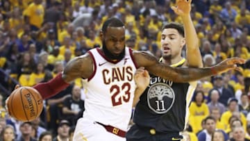 OAKLAND, CA - JUNE 03: LeBron James #23 of the Cleveland Cavaliers drives against Klay Thompson #11 of the Golden State Warriors in Game 2 of the 2018 NBA Finals at ORACLE Arena on June 3, 2018 in Oakland, California. NOTE TO USER: User expressly acknowledges and agrees that, by downloading and or using this photograph, User is consenting to the terms and conditions of the Getty Images License Agreement. (Photo by Ezra Shaw/Getty Images)
