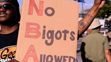 Apr 29, 2014; Los Angeles, CA, USA; Clyde Davis, of Long Beach, at a demonstration in front of Staples Center demanding the sale of the team. The NBA handed down a lifetime ban on Clipper owner Donald Sterling after it was confirmed that he made racist statements capture on a recording by his girlfriend. The Clippers and Warrior play game five of the first round of the 2014 NBA Playoffs at Staples Center. Mandatory Credit: Robert Hanashiro-USA TODAY Sports