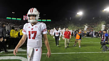 Badgers quarterback Jack Coan leaves the field after the Rose Bowl loss to Oregon.Rosebowl 26 Wood