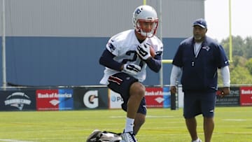 May 26, 2016; Foxborough, MA, USA; New England Patriots running backs coach Ivan Fears looks on as rookie running back D.J. Foster (27) runs drills during OTA