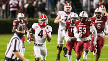 Nov 28, 2020; Columbia, South Carolina, USA; Georgia Bulldogs running back James Cook (4) rushes for a long gain against the South Carolina Gamecocks during the first quarter at Williams-Brice Stadium. Mandatory Credit: Jeff Blake-USA TODAY