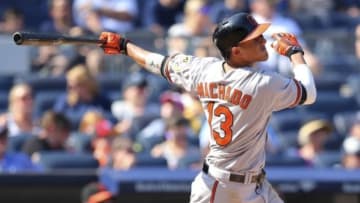 Sep 7, 2015; Bronx, NY, USA; Baltimore Orioles shortstop Manny Machado (13) hits a solo home run against the New York Yankees during the seventh inning at Yankee Stadium. Mandatory Credit: Brad Penner-USA TODAY Sports