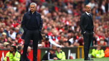 MANCHESTER, ENGLAND - SEPTEMBER 10: Jose Mourinho, Manager of Manchester United (L) and Josep Guardiola, Manager of Manchester City look on during the Premier League match between Manchester United and Manchester City at Old Trafford on September 10, 2016 in Manchester, England. (Photo by Clive Brunskill/Getty Images)