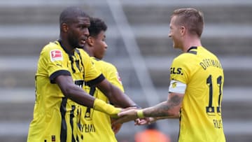 Dortmund's French forward Anthony Modeste (L) celebrates scoring the opening goal with his teammate Dortmund's German forward Marco Reus during the German first division Bundesliga football match between Hertha Berlin and Borussia Dortmund in Berlin on August 27, 2022. - DFL REGULATIONS PROHIBIT ANY USE OF PHOTOGRAPHS AS IMAGE SEQUENCES AND/OR QUASI-VIDEO (Photo by Ronny HARTMANN / AFP) / DFL REGULATIONS PROHIBIT ANY USE OF PHOTOGRAPHS AS IMAGE SEQUENCES AND/OR QUASI-VIDEO (Photo by RONNY HARTMANN/AFP via Getty Images)