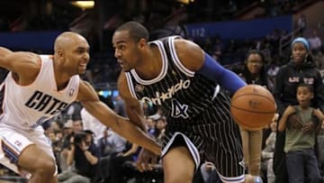 Jan 17, 2014; Orlando, FL, USA; Orlando Magic shooting guard Arron Afflalo (4) drives to the basket as Charlotte Bobcats shooting guard Gerald Henderson (9) defends during the second half at Amway Center. Bobcats won 111-101. Mandatory Credit: Kim Klement-USA TODAY Sports