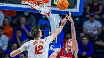 Florida Gators forward Colin Castleton (12) blocks Stony Brook Seawolves center Keenan Fitzmorris (32) during the first half as Florida takes on Stoney Brook during an NCAA college basketball game at Steven C. O'Connell Center Monday, Nov. 7, 2022, in Gainesville, Fla. (Alan Youngblood/Gainesville Sun)Flgai Mbb Gators Vs Stoneybrook 00202781