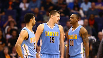 Nov 27, 2016; Phoenix, AZ, USA; Denver Nuggets guard Jamal Murray (27), forward Nikola Jokic (15) and forward Darrell Arthur (00) against the Phoenix Suns at Talking Stick Resort Arena. The Nuggets defeated the Suns 118-114. Mandatory Credit: Mark J. Rebilas-USA TODAY Sports