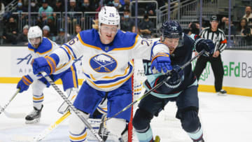 Nov 4, 2021; Seattle, Washington, USA; Buffalo Sabres defenseman Rasmus Dahlin (26) skates against Seattle Kraken right wing Joonas Donskoi (72) during the second period at Climate Pledge Arena. Mandatory Credit: Joe Nicholson-USA TODAY Sports