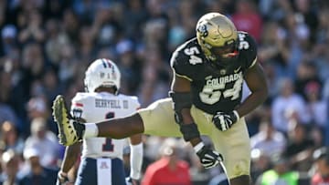 BOULDER, CO - OCTOBER 16: Defensive end Terrance Lang #54 of the Colorado Buffaloes celebrates a second quarter stop in the red zone during a game against the Arizona Wildcats at Folsom Field on October 16, 2021 in Boulder, Colorado. (Photo by Dustin Bradford/Getty Images)