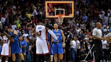 Dec 29, 2014; Miami, FL, USA; Miami Heat guard Dwyane Wade (3) greets Orlando Magic guard Victor Oladipo (5) after the defeating the Heat at American Airlines Arena. Mandatory Credit: Steve Mitchell-USA TODAY Sports