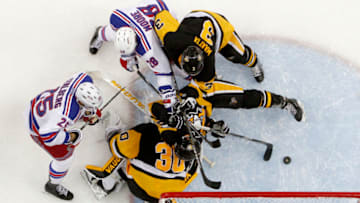 PITTSBURGH, PA - APRIL 23: Matt Murray #30 of the Pittsburgh Penguins makes a save against Viktor Stalberg #25 and Dominic Moore #28 of the New York Rangers in Game Five of the Eastern Conference First Round during the 2016 NHL Stanley Cup Playoffs at Consol Energy Center on April 23, 2016 in Pittsburgh, Pennsylvania. (Photo by Justin K. Aller/Getty Images)