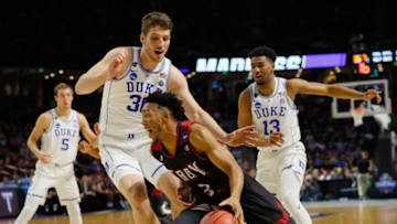 GREENVILLE, SC - MARCH 17: Wesley Person #3 of the Troy Trojans drives against Antonio Vrankovic #30 of the Duke Blue Devils in the first half during the first round of the 2017 NCAA Men's Basketball Tournament at Bon Secours Wellness Arena on March 17, 2017 in Greenville, South Carolina. (Photo by Kevin C. Cox/Getty Images)