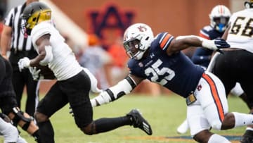 Auburn football defensive end Colby Wooden (25) tails Alabama State Hornets running back Jacory Merritt (2) at Jordan-Hare Stadium in Auburn, Ala., on Saturday, Sept. 11, 2021. Auburn Tigers leads Alabama State Hornets 20-0 at halftime.