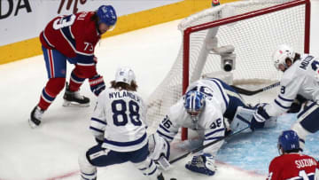 May 29, 2021; Montreal, Quebec, CAN; Toronto Maple Leafs goaltender Jack Campbell (36) makes a save against Montreal Canadiens right wing Tyler Toffoli (73) as center William Nylander (88) defends during the first period in game six of the first round of the 2021 Stanley Cup Playoffs at Bell Centre. Mandatory Credit: Jean-Yves Ahern-USA TODAY Sports