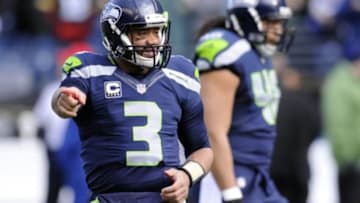 Jan 18, 2015; Seattle, WA, USA; Seattle Seahawks quarterback Russell Wilson (3) points during warm-ups prior to facing the Green Bay Packers in the NFC Championship Game at CenturyLink Field. Mandatory Credit: Steven Bisig-USA TODAY Sports