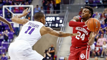 Mar 5, 2016; Fort Worth, TX, USA; Oklahoma Sooners guard Buddy Hield (24) looks to pass as TCU Horned Frogs guard Brandon Parrish (11) defends during the first half at Ed and Rae Schollmaier Arena. Mandatory Credit: Kevin Jairaj-USA TODAY Sports