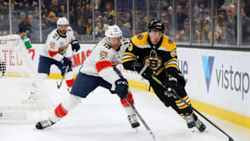 BOSTON, MASSACHUSETTS - MARCH 07: Mike Matheson #19 of the Florida Panthers defends Brad Marchand #63 of the Boston Bruins during the first period at TD Garden on March 07, 2019 in Boston, Massachusetts. (Photo by Maddie Meyer/Getty Images)