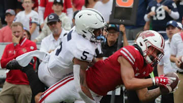 Wisconsin wide receiver Danny Davis III (7) catches a pass just short of the end zone while being covered by Penn State cornerback Tariq Castro-Fields (5) during the fourth quarter of their game Saturday, September 4, 2021 at Camp Randall Stadium in Madison, Wis. Penn State beat Wisconsin 16-10.Uwgrid05 1