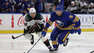 Oct 16, 2021; Buffalo, New York, USA; Buffalo Sabres center Drake Caggiula (91) skates up ice with the puck as Arizona Coyotes defenseman Ilya Lyubushkin (46) tries to defend during the second period at KeyBank Center. Mandatory Credit: Timothy T. Ludwig-USA TODAY Sports