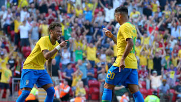 LIVERPOOL, ENGLAND - JUNE 03: Firmino of Brazil celebrates after scoring his sides second goal with Neymar Jr of Brazil during the International Friendly match between Croatia and Brazil at Anfield on June 3, 2018 in Liverpool, England. (Photo by Alex Livesey/Getty Images)
