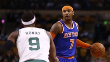 Dec 12, 2014; Boston, MA, USA; New York Knicks forward Carmelo Anthony (7) dribbles the ball against Boston Celtics guard Rajon Rondo (9) during the first half at TD Garden. Mandatory Credit: Mark L. Baer-USA TODAY Sports