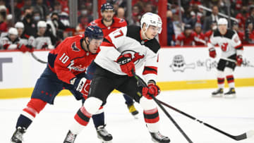 Jan 2, 2022; Washington, District of Columbia, USA; New Jersey Devils center Yegor Sharangovich (17) possess the puck as Washington Capitals right wing Daniel Sprong (10) chases during the third period at Capital One Arena. Mandatory Credit: Brad Mills-USA TODAY Sports