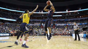 WASHINGTON, DC - MARCH 09: Malcolm Hill #21 of the Illinois Fighting Illini puts up a shot in front of Zak Irvin #21 of the Michigan Wolverines in the first half of the Big Ten Basketball Tournament at Verizon Center on March 9, 2017 in Washington, DC. (Photo by Rob Carr/Getty Images)