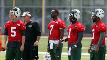 Jun 17, 2014; Florham Park, USA; New York Jets quarterbacks Matt Simms (5), Geno Smith (7) , Michael Vick and Tajh Boyd (3) with quarterback coach David Lee during New York Jets minicamp at Atlantic Health Training Center. Mandatory Credit: Noah K. Murray-USA TODAY Sports