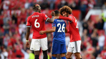 MANCHESTER, ENGLAND - AUGUST 26: Riyad Mahrez of Leicester City speaks with Paul Pogba and Marouane Fellaini of Manchester United following the Premier League match between Manchester United and Leicester City at Old Trafford on August 26, 2017 in Manchester, England. (Photo by Michael Regan/Getty Images)