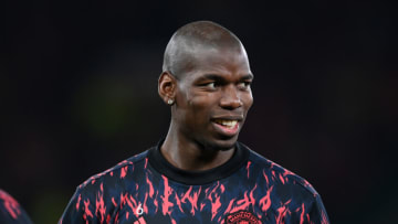 MANCHESTER, ENGLAND - MARCH 15: Paul Pogba of Manchester United warms up prior to the UEFA Champions League Round Of Sixteen Leg Two match between Manchester United and Atletico Madrid at Old Trafford on March 15, 2022 in Manchester, England. (Photo by Michael Regan/Getty Images)