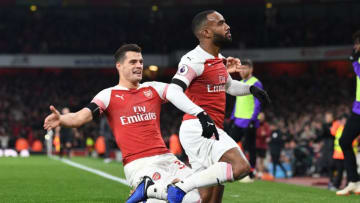 LONDON, ENGLAND - NOVEMBER 03: (R) Alex Lacazette celebrates scoring the Arsenal goal with (L) Granit Xhaka during the Premier League match between Arsenal FC and Liverpool FC at Emirates Stadium on November 3, 2018 in London, United Kingdom. (Photo by Stuart MacFarlane/Arsenal FC via Getty Images)