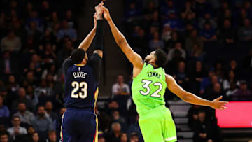 MINNEAPOLIS, MN - JANUARY 12: Karl-Anthony Towns of the Minnesota Timberwolves blocks a shot by Anthony Davis of the New Orleans Pelicans. (Photo by David Berding/Getty Images)