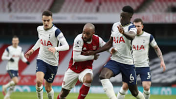 Alexandre Lacazette of Arsenal is challenged by Davinson Sanchez of Tottenham Hotspur. (Photo by Nick Potts - Pool/Getty Images)