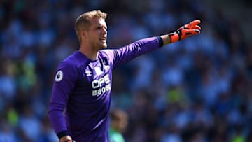 HUDDERSFIELD, ENGLAND - APRIL 20: Jonas Lossl of Huddersfield Town gives his team instructions during the Premier League match between Huddersfield Town and Watford FC at John Smith's Stadium on April 20, 2019 in Huddersfield, United Kingdom. (Photo by Nathan Stirk/Getty Images)